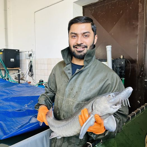 Mujahid Ali Shah holding an aquatic animal