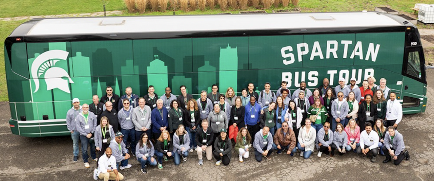 Shot of MSU tour participants before Spartan Bus