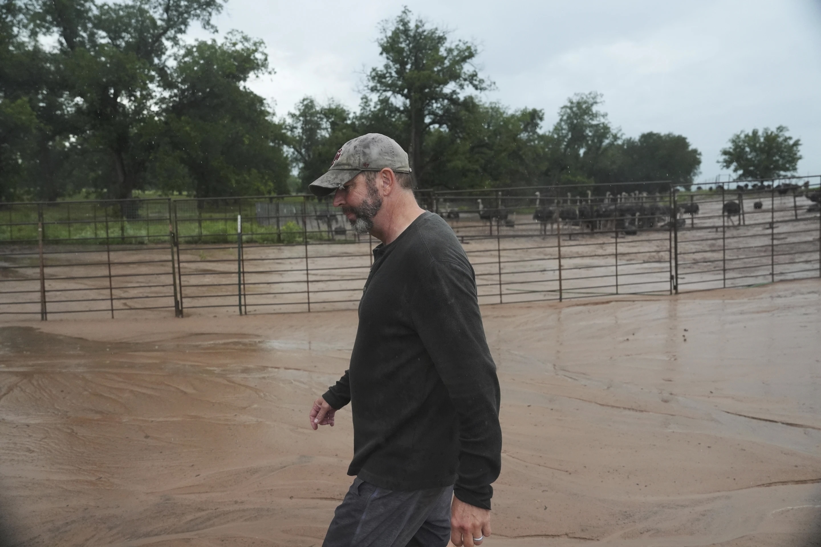 Man walking through floodwaters